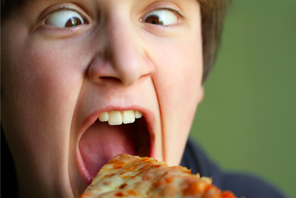 boy-eating-frozen-pizza