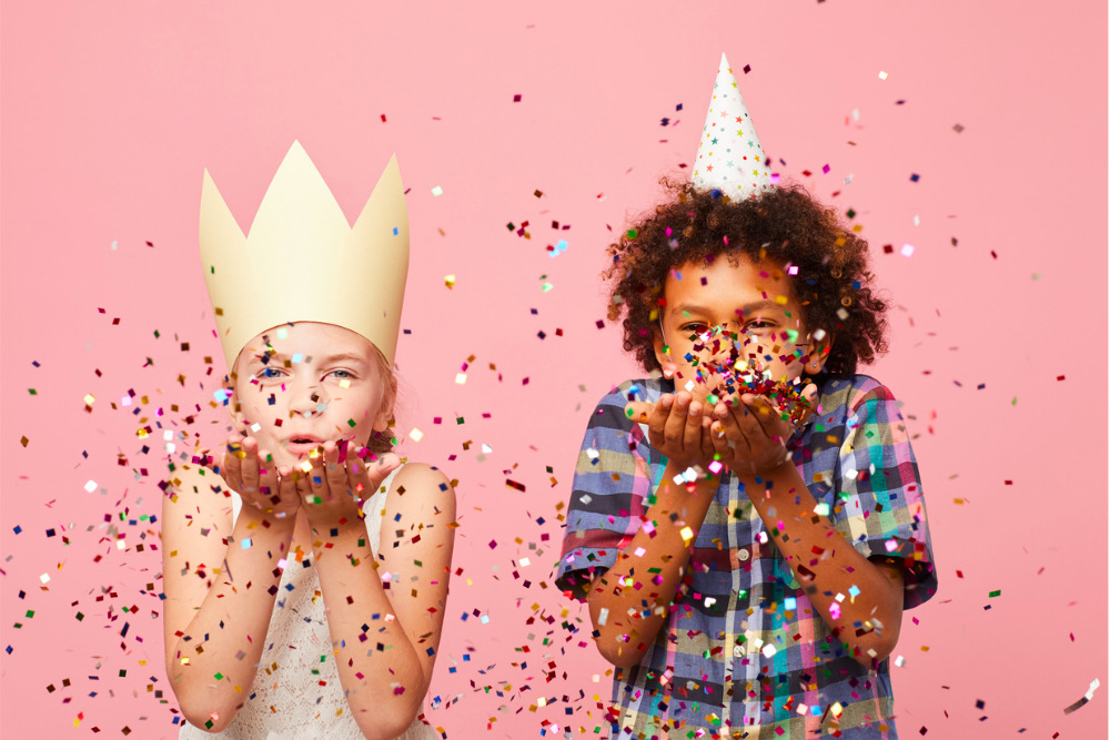 kids-at-party-blowing-confetti